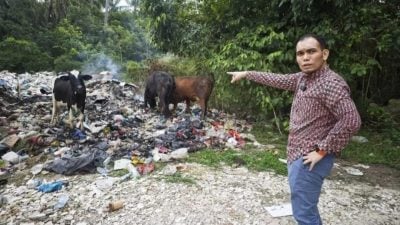 非法垃圾“毒烟”停不了 消拯队出动推土机灭火