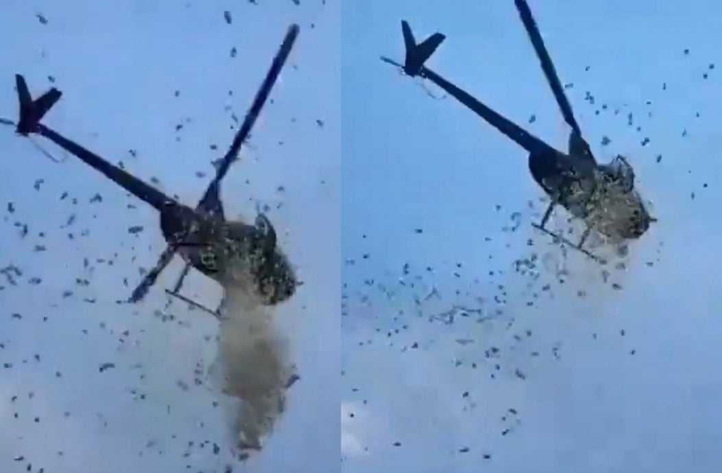 底特律街头现“钞票雨” 暖心举动传递城市温度