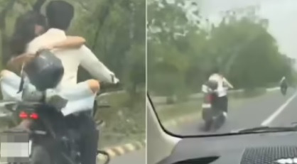 高速公路做出危险行为 情侣相拥共骑被罚