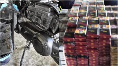 视频| 摩托夹层藏400多包漏税烟 兀兰关卡遭执法人员揭发