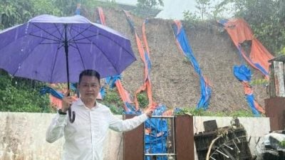 遮盖帆布残破不堪 . 赖包花园土崩 愁恶化