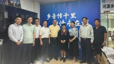 谭育良访河源乡情报社 共商文化侨乡发展