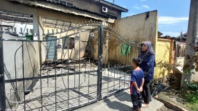 4廉价屋连环烧  男子披湿毛巾跳墙逃生