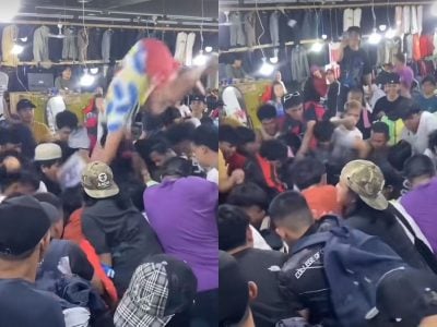 男人抢购特价衣   “跳水”潜入衣堆“寻宝”