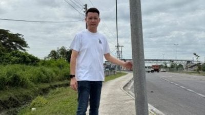 林思健：带来安全隐忧 . 走道竖电讯柱 阻通行