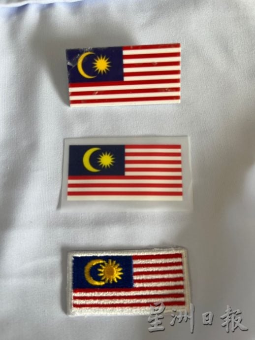 国旗扣章意外频传 安全至上缝制和磁铁式受欢迎