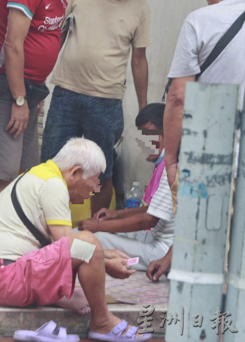 揭发半山芭街头聚赌