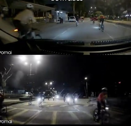 大都会/一群脚车骑士左右穿插骑行,导致其他轿车得放慢车速