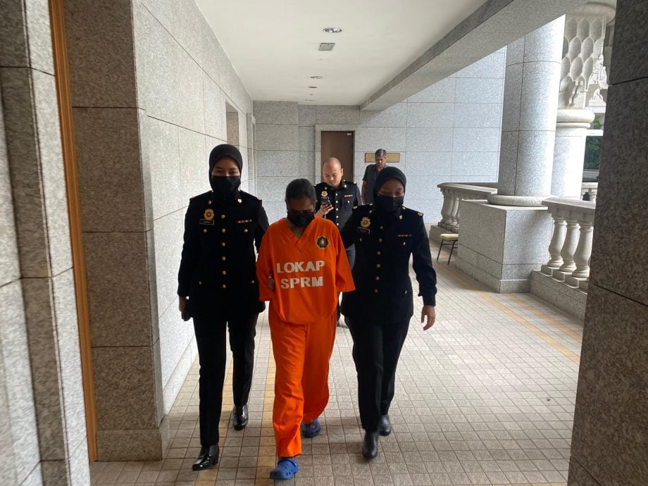 已签/艾瑾/假投资计划骗走2100万令吉 保险代理被扣5天