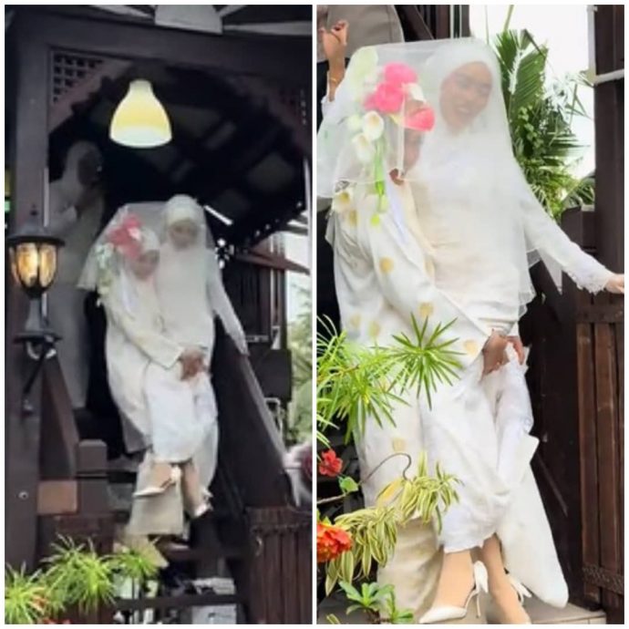 视频|新娘穿窄婚纱难下楼 伴娘义气相挺一手抱起