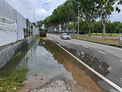 雨后甲市区出现数以百计“小水潭”,影响车辆通行及甲形象