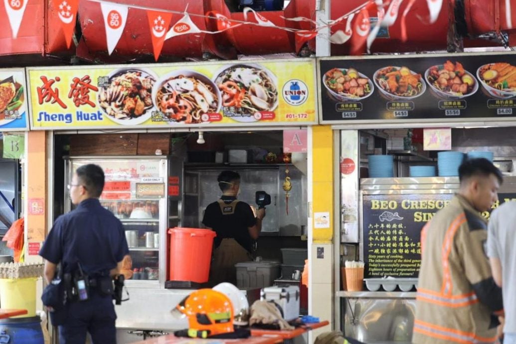 (已签发)柔:狮城二三事:小贩中心面摊突传两巨响 民防封锁现场调查