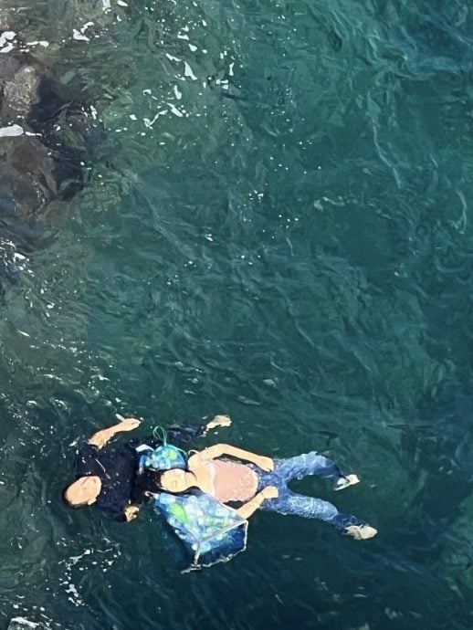 视频|用嘴紧咬头发救下坠海女 中籍残疾游客获赞真英雄!