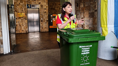 Trash bin repurposed as rostrum for deputy minister