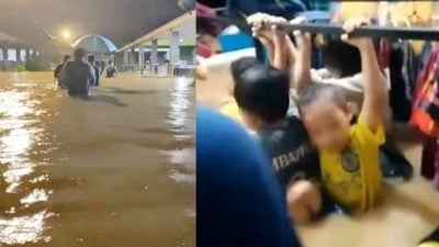 倾盆大雨洪水来袭 孩童抓衣架防被冲走