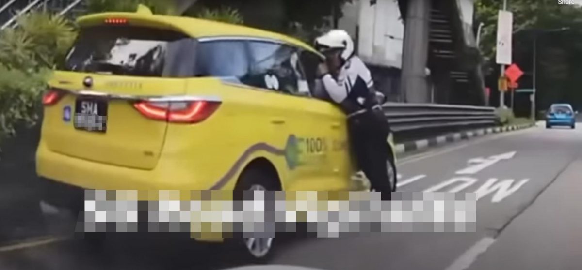 *已签发*柔:狮城二三事:狮城七旬德士司机拒配合调查 关车窗拖行交警致手臂骨折