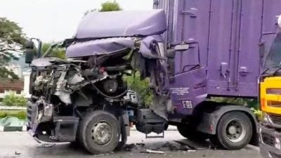 疑遇车龙刹车不及 集装箱罗里连环撞