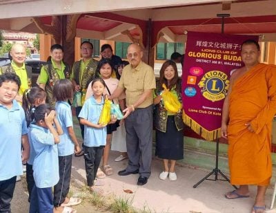 辉煌文化城狮子会 到坐佛寺展开善心活动