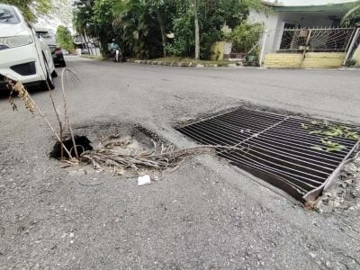 疑隆市局监管不力 重铺路段又现坑洞