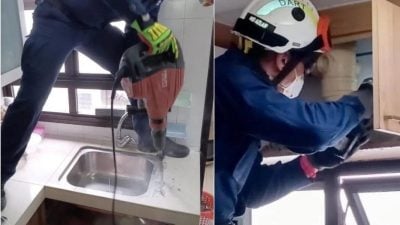 男子手臂卡厨房排水管  狮城民防员拆水槽橱柜解救