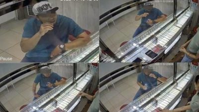 假扮顾客抢金手链  男子遭警通缉