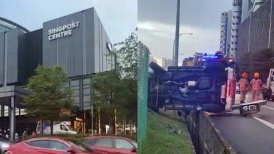 汽车打滑后侧翻 悬空停在沟渠上