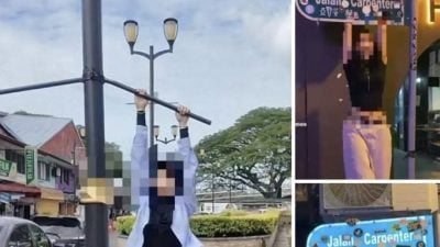 ​3人挂路牌灯柱拍视频  古晉北市局报警喊查