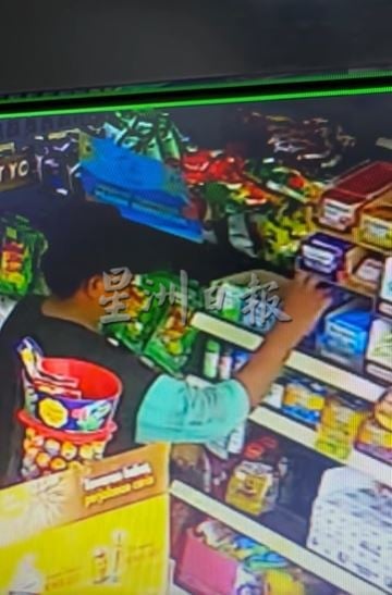 供星洲网/戴帽男偷糖果又偷玩具车 油站寻人:叫他回来付款!