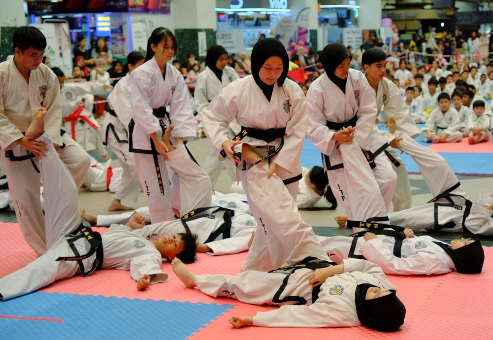 (7/12见报）星角摄/ea跆拳道磨练体魄，也锤炼意志。