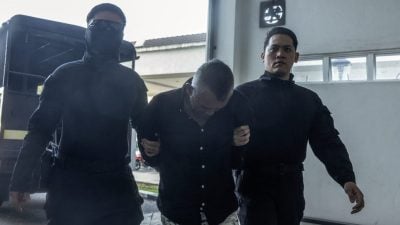 伍长涉抢劫杂货店 不认罪 1.8万保外候审