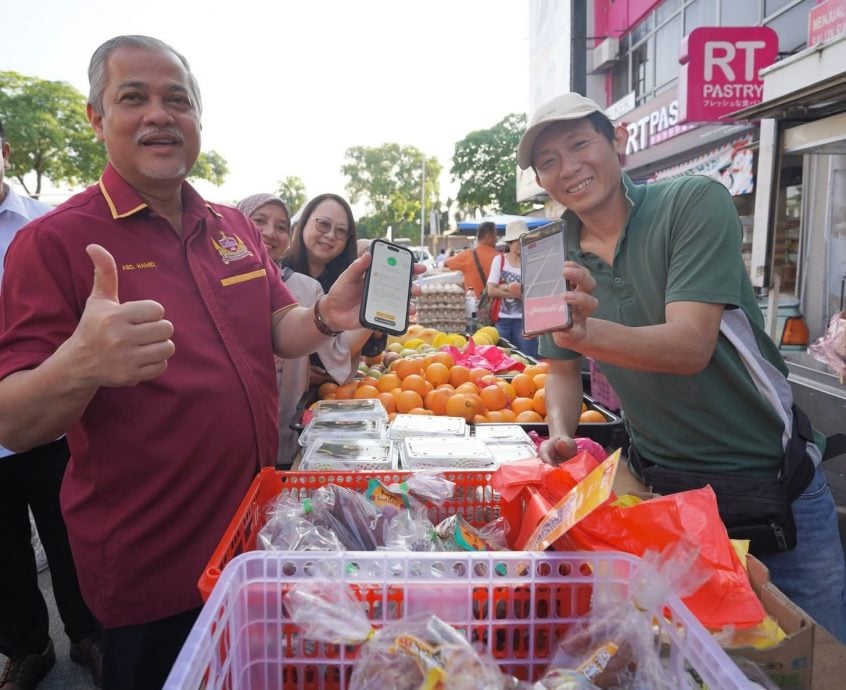 已签发（大都会）巴生市政厅在永安镇派发数码优惠券获热烈回响