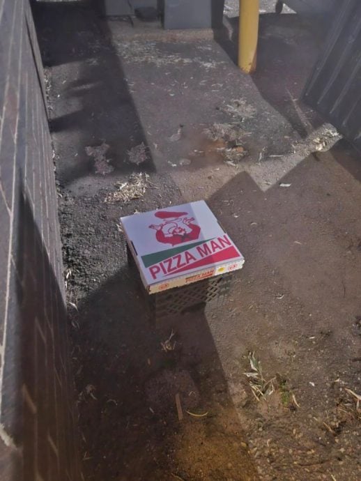 暖势力 不忍发现有人翻垃圾桶觅食 披萨店老板暖心告示免费供餐