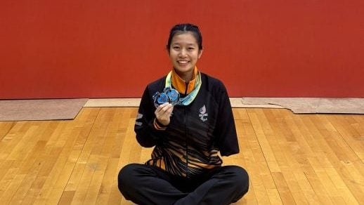 一手握书也握球拍 身障乒乓国手双轨道奔跑