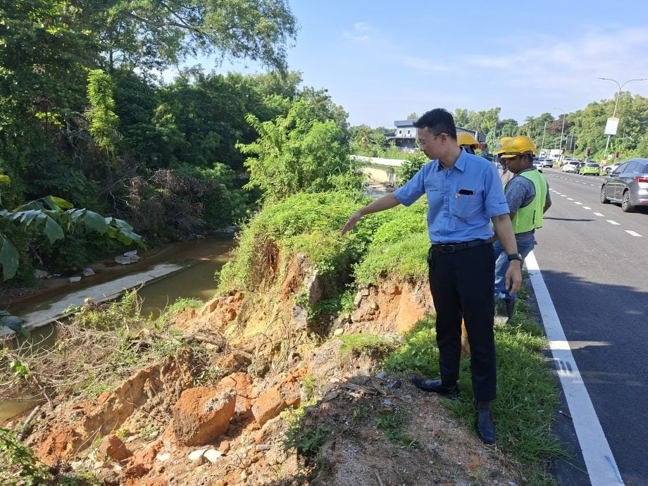 请签发-大都会／河堤土崩范围接近道路，承包商紧急处理／2图