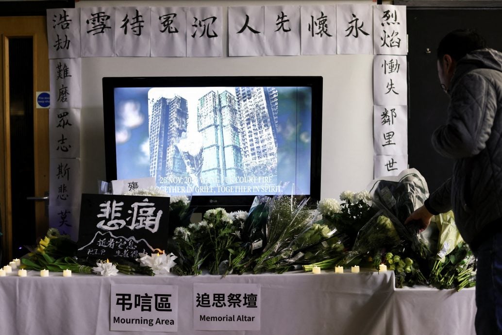 配头数图∕港立法会选举HONGKONG-FIRE/LOSS:The Wider Image - Hong Kong fire: Echoes of loss below burnt towers