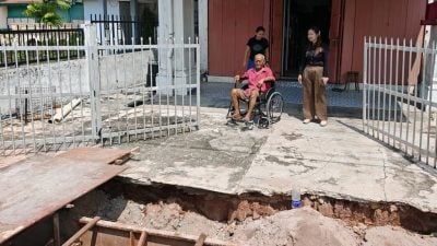 不符规定拆除重做拖延30户怨   提升沟渠 阻进出家门