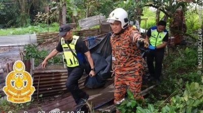 消拯员将遗体移下  男子吊毙住家附近树上